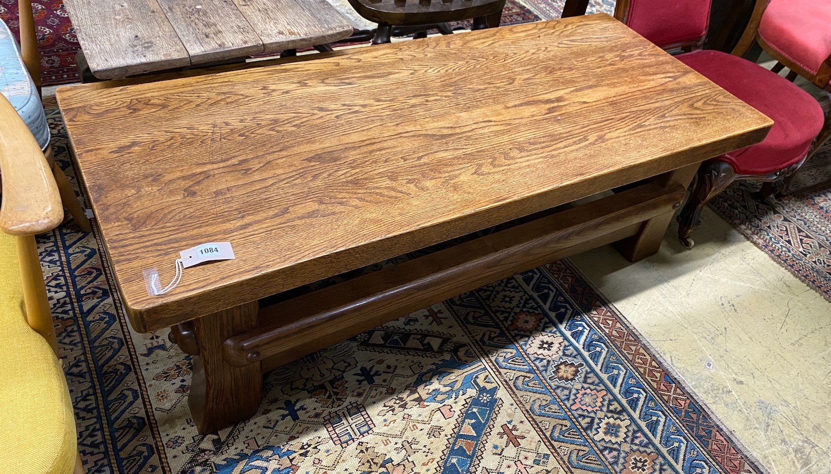 A French Brutalist oak coffee table, width 137cm, depth 57cm, height 46cm